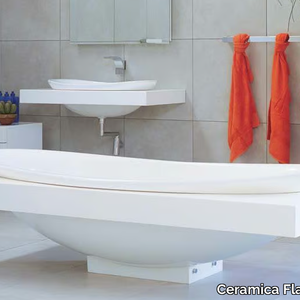 IO - Freestanding oval Pietraluce® bathtub _ Ceramica Flaminia