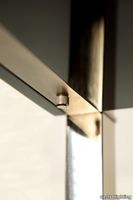 Castro-lighting-Interiors-gaya-bookshelf-gold-brass-black-lacquered-bookcase-design-detail-golden-bolt.jpg thumb image