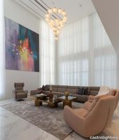 castro-lighting-luxury-ease-residential-home-design-in-nigeria-large-living-room-featuring-mystic-suspension-on.jpg thumb image