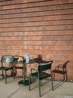 16645-en-linear-steel-armchair-cafe-table-h73-round-dark-green-tub-jug-pale-blue-muuto-org.tif thumb image