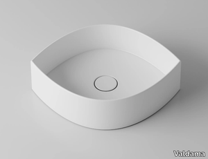 OCCHIO - Countertop ceramic washbasin _ Valdama