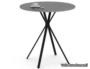 CURVA - Round iron table with 4-star base _ Vela Arredamenti