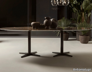 JAMES - Oval marble table with 4-star base _ Antoniolupi