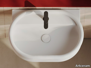 BRERA - Wall-mounted oval ceramic washbasin with overflow and tap hole _ Artceram