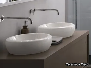 FLUID - Countertop oval ceramic washbasin _ Ceramica Cielo