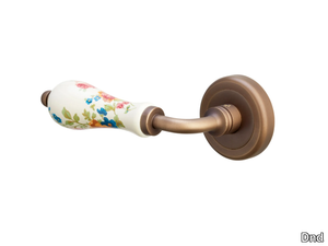 MARTINA - Brass and porcelain door handle on rose _ Dnd