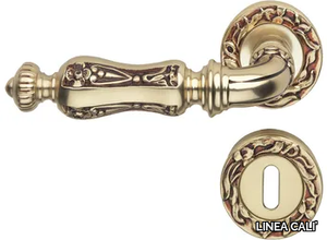 SOLEIL - Chromed brass door handle on rose with lock _ LINEA CALI'