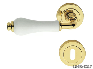 DALIA - Classic style metal door handle on rose with lock _ LINEA CALI'