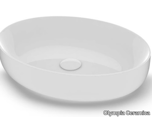 METAMORFOSI - Countertop oval ceramic washbasin _ Olympia Ceramica