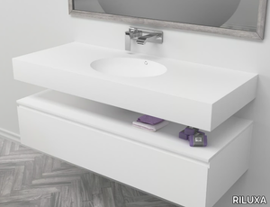 PURITY - Wall-mounted single oval Corian® washbasin _ RILUXA