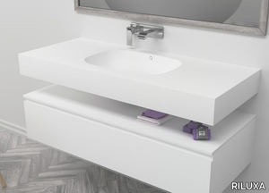 PEACE - Wall-mounted single oval Corian® washbasin _ RILUXA