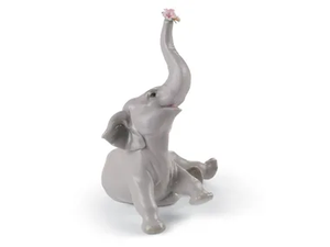 BABY ELEPHANT WITH PINK FLOWER - Porcelain decorative object _ Lladró