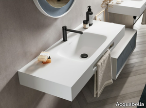 MOIWA - Rectangular Dolotek© washbasin with integrated countertop with towel rail _ Acquabella