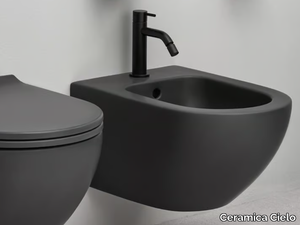 ENJOY - Wall-hung back to wall ceramic bidet with overflow _ Ceramica Cielo