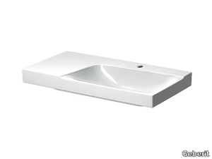 XENO² - Porcelain stoneware washbasin with integrated countertop _ Geberit