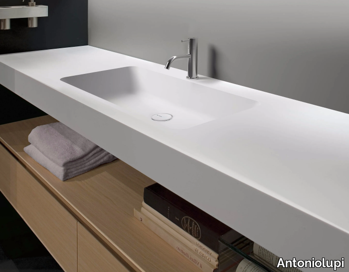 ARCO - Corian® washbasin with integrated countertop _ Antoniolupi