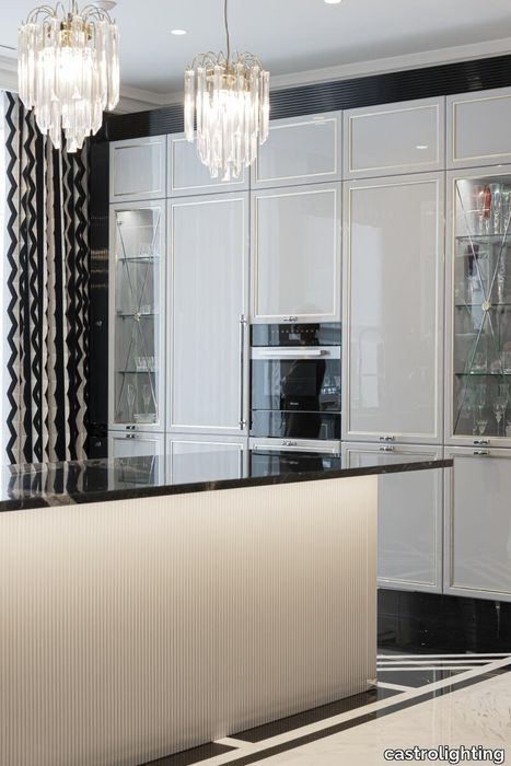 Opulent_Residence_in_Lithuania_black_marble_kitchen_feat_lotus_pendant_side_vision.jpg