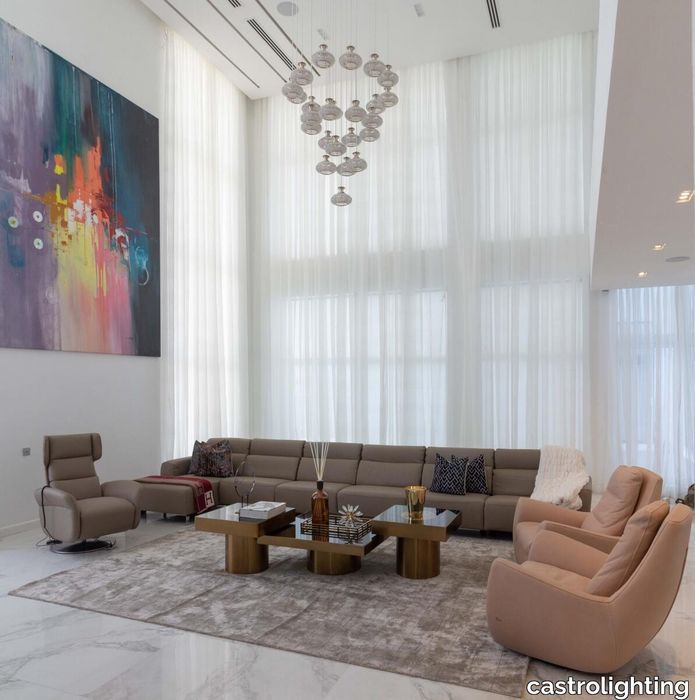 castro-lighting-luxury-ease-residential-home-design-in-nigeria-large-living-room-featuring-mystic-suspension-off.jpg