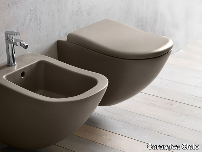 FLUID - Wall-hung ceramic toilet _ Ceramica Cielo