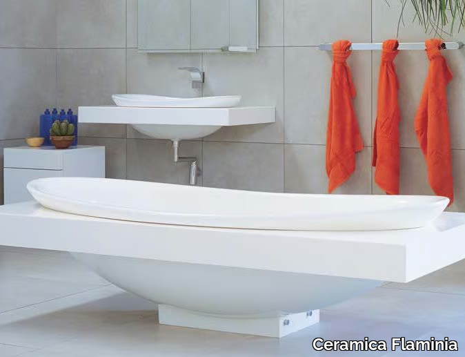 IO - Freestanding oval Pietraluce® bathtub _ Ceramica Flaminia