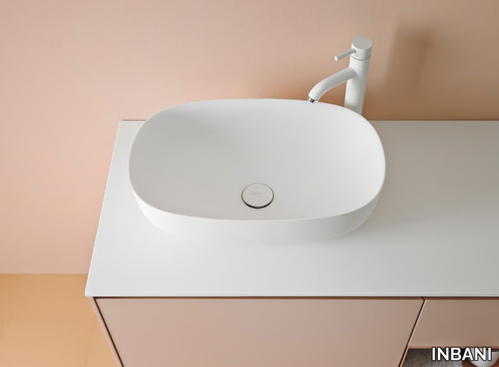 OVALO - Countertop oval Corian® washbasin _ INBANI