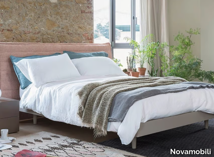 ROLLING - Double bed with upholstered headboard _ Novamobili