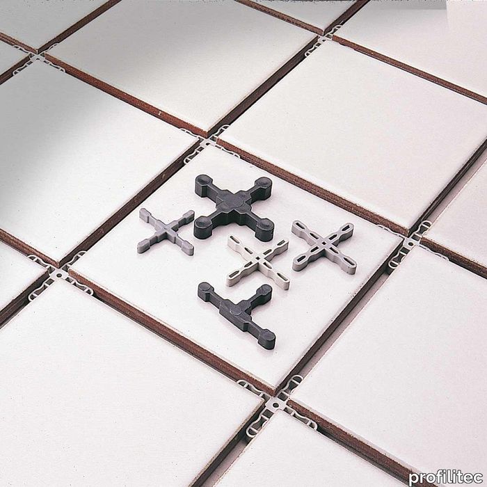 Plastic "T" tie-bases to be used tiling floors and walls