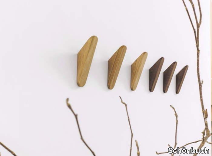 CUT - Wall-mounted solid wood coat rack _ Schönbuch