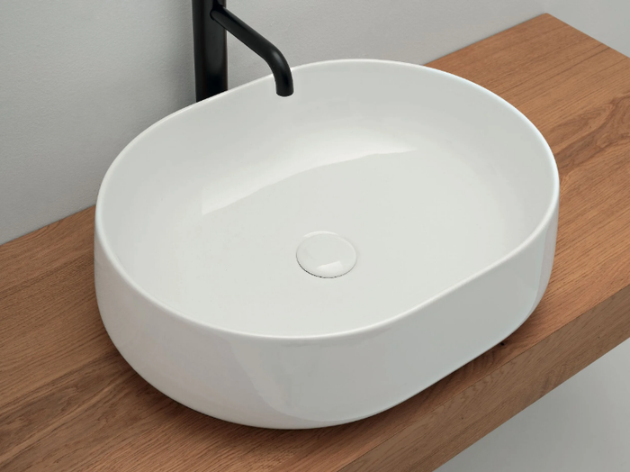 CIOTOLA - Oval countertop ceramic washbasin _ COLAVENE