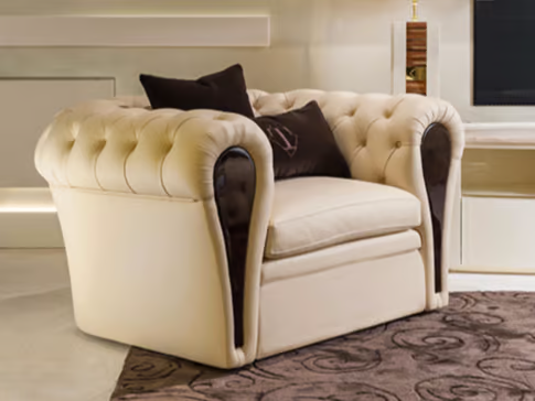 MAYFAIR - Tufted leather lobby chair with armrests _ Turri