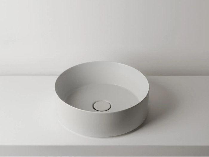 TRACK - Countertop round single ceramic washbasin _ Valdama